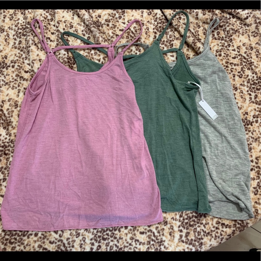Three tank tops: purple, green, grey